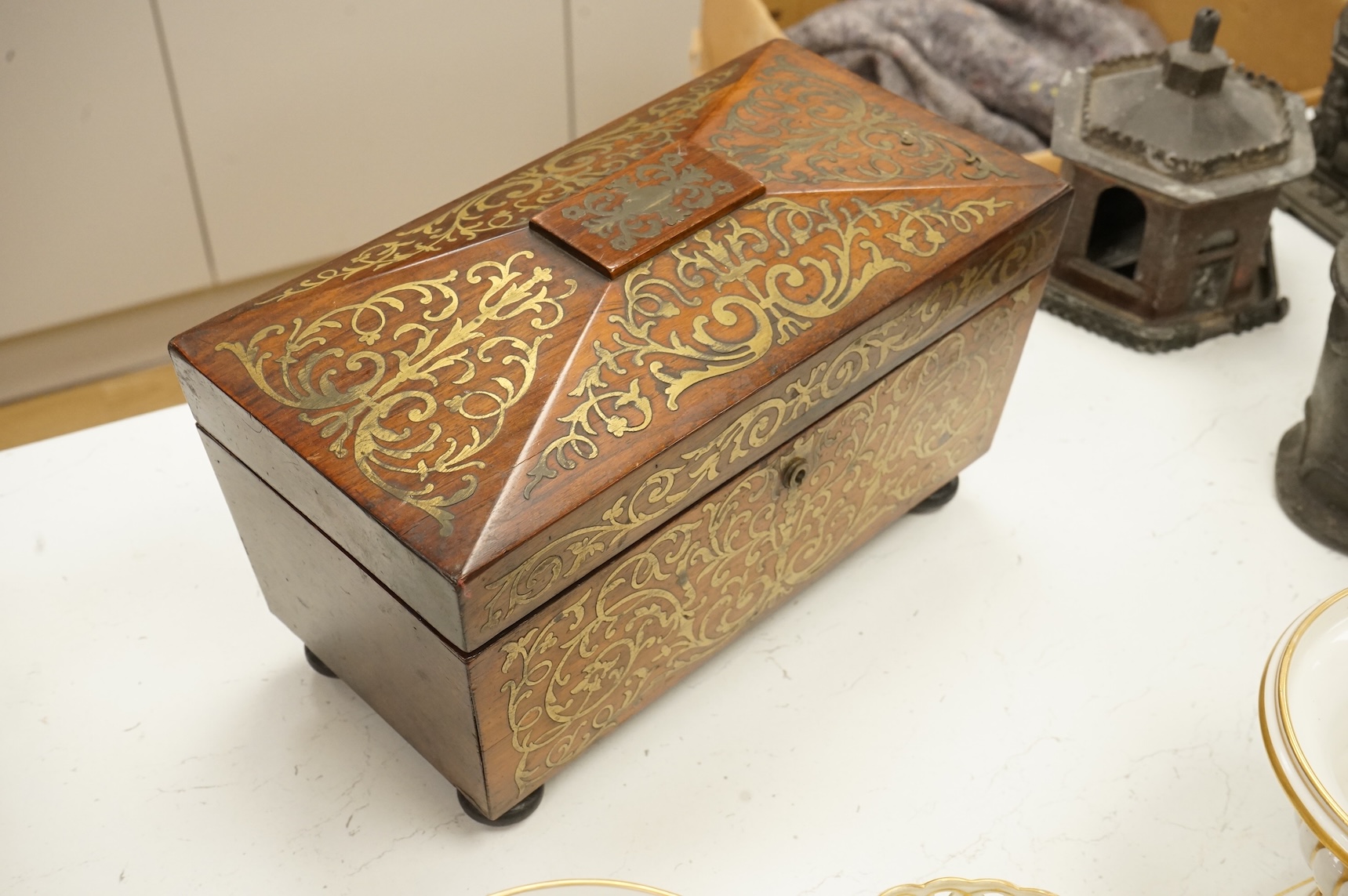 A William IV rosewood and cut brass inlaid tea caddy, 32cm wide